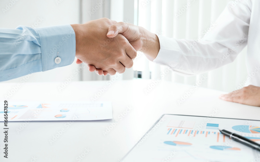 Business people shaking hands, finishing up a meeting Business people shaking hands, finishing up a meeting