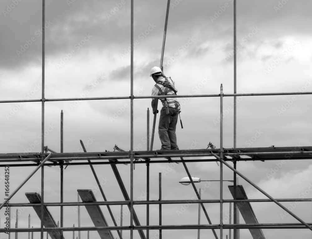 Construction worker on scaffold