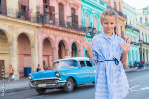 Photography Adorable little girl in popular area in Old Havana, Cuba