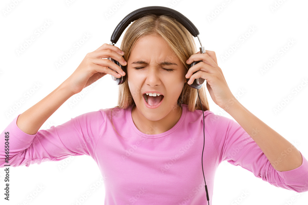 Happy singing teenage girl with headphones isolated Happy singing teenage girl with headphones isolated