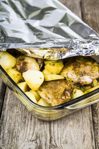 Potatoes with chicken baked in the oven.