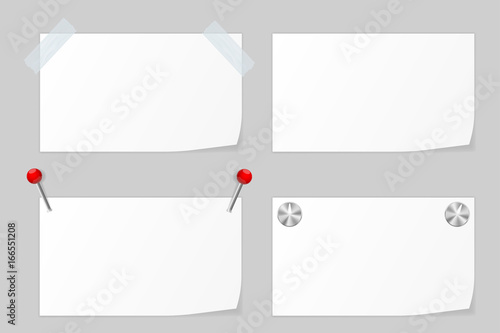 White paper notice attached to the wall with stationery pins