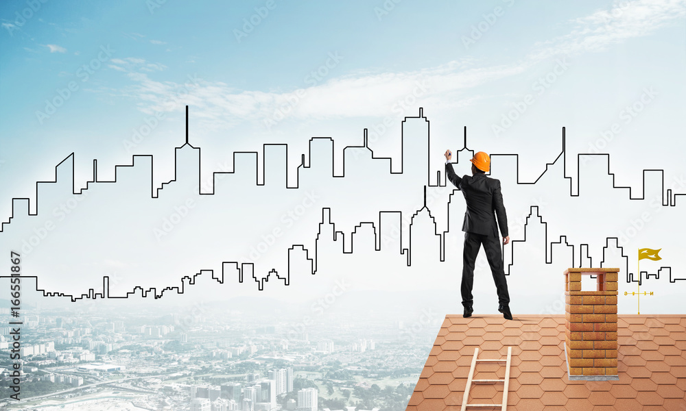 Man architect draw silhouette of modern city on blue sky. Mixed media Man architect draw silhouette of modern city on blue sky. Mixed media
