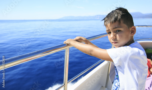 Boy in a deck of a cruise