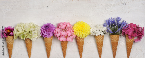 Fototapeta Naklejka Na Ścianę i Meble -  ice cream cones with beautiful flowers