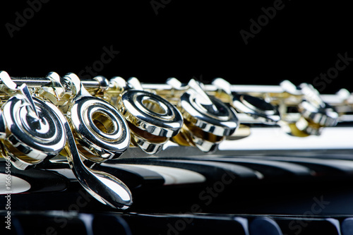 Fotografija jazz music instrument flute close up isolated on black background