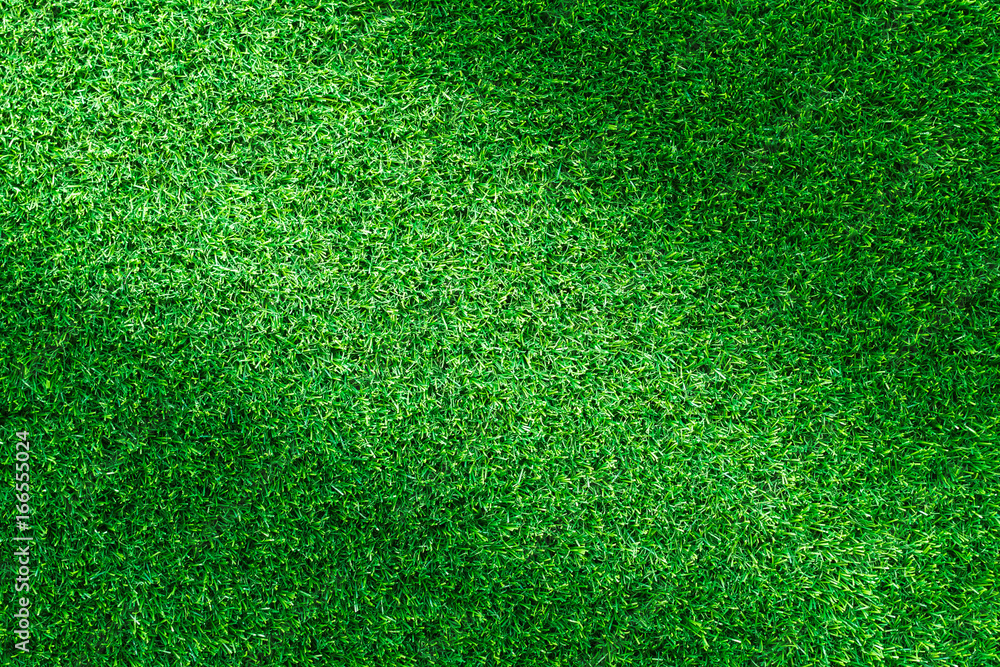Obraz premium Artificial green grass texture for golf course. soccer field or sports background concept design.