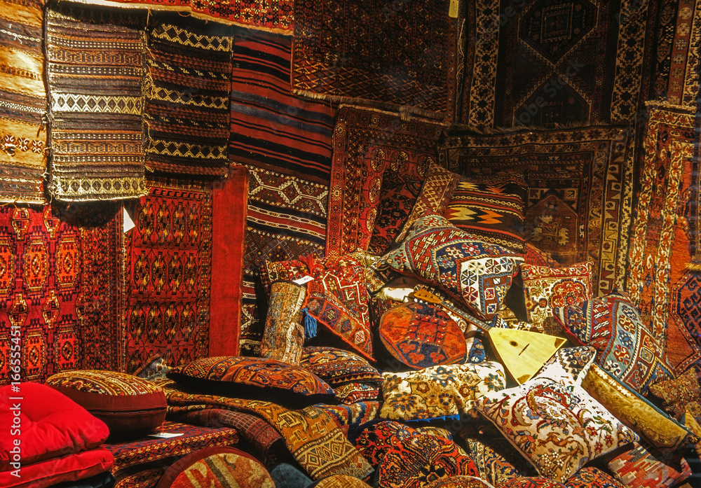 Pillows,bags and carpets in large pile