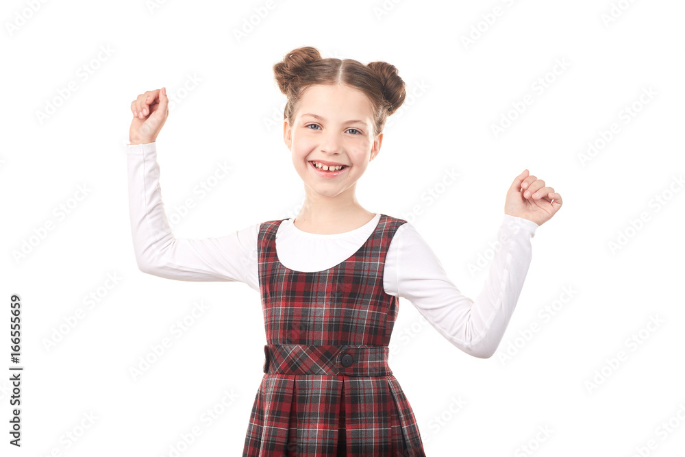 Portrait of cute girl in school uniform celebrating success against white background Portrait of cute girl in school uniform celebrating success against white background