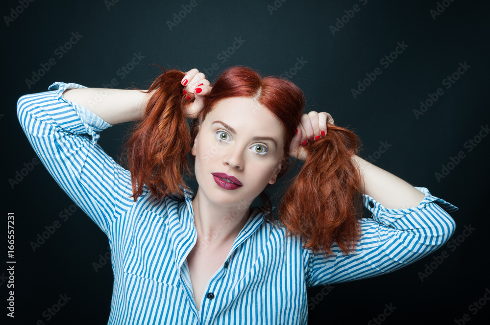 Fototapeta premium Sensual woman holding and pull her hair