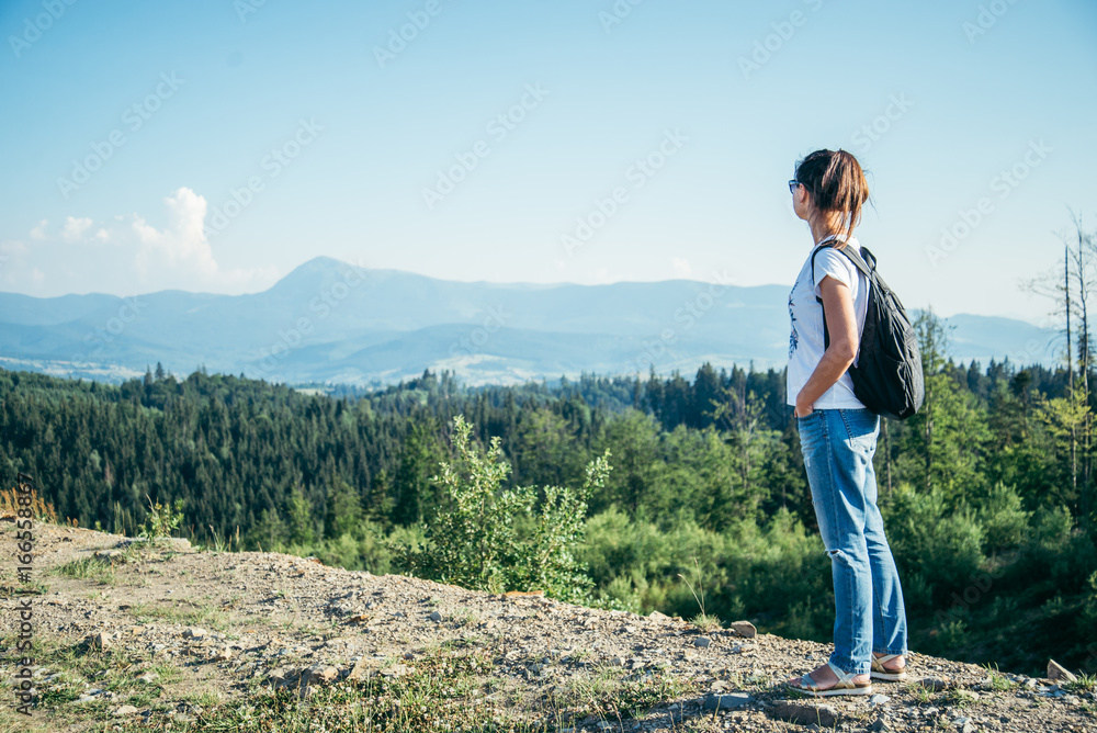 woman enjoy panoramic view from the top of the mountain