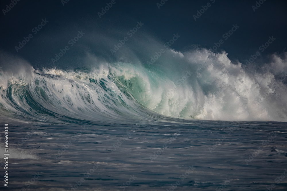 Huge waves crashing in storming ocean. Seascape rough environment background. Water texture with foam and splashes. Hawaiian surfing spot with nobody