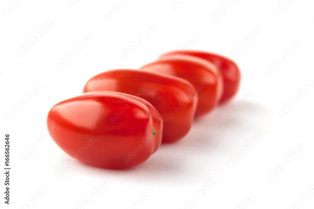 Four tomatoes on a white background with shadows Four tomatoes on a white background with shadows