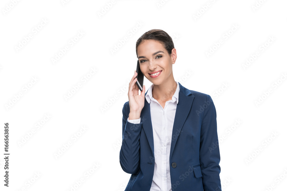 beautiful smiling businesswoman in suit using smartphone, isolated on white beautiful smiling businesswoman in suit using smartphone, isolated on white