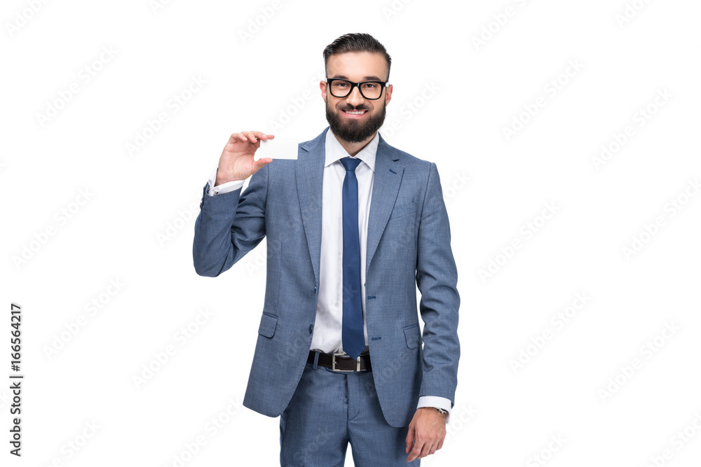 Handsome smiling businessman holding empty business card, isolated on white Handsome smiling businessman holding empty business card, isolated on white