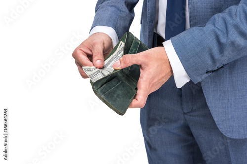 cropped view of businessman holding wallet with dollar banknotes, isolated on white