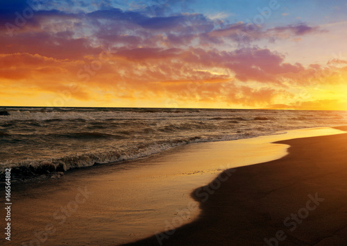 Colorful sunset sky above the sea. Nature background.