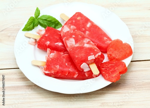 Homemade ice lolly from water melon & almond pieces