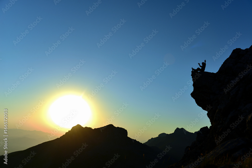 enjoyment of a view of the sunrise on the rock