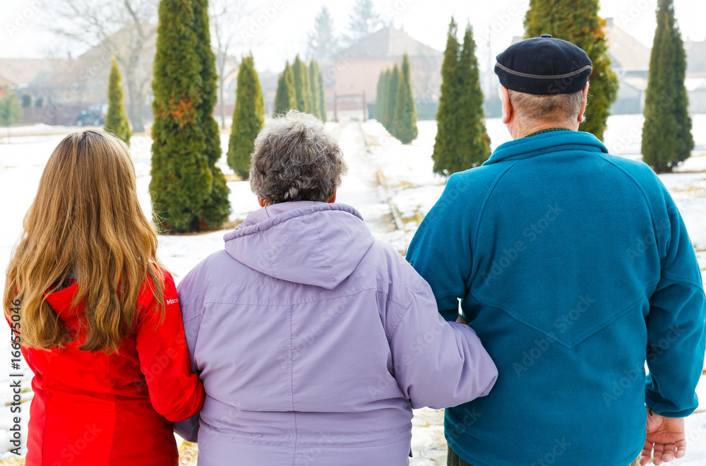 Elderly couple and young caregiver Elderly couple and young caregiver