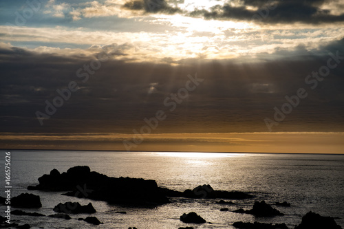 Ligth breaking through clouds at sunset