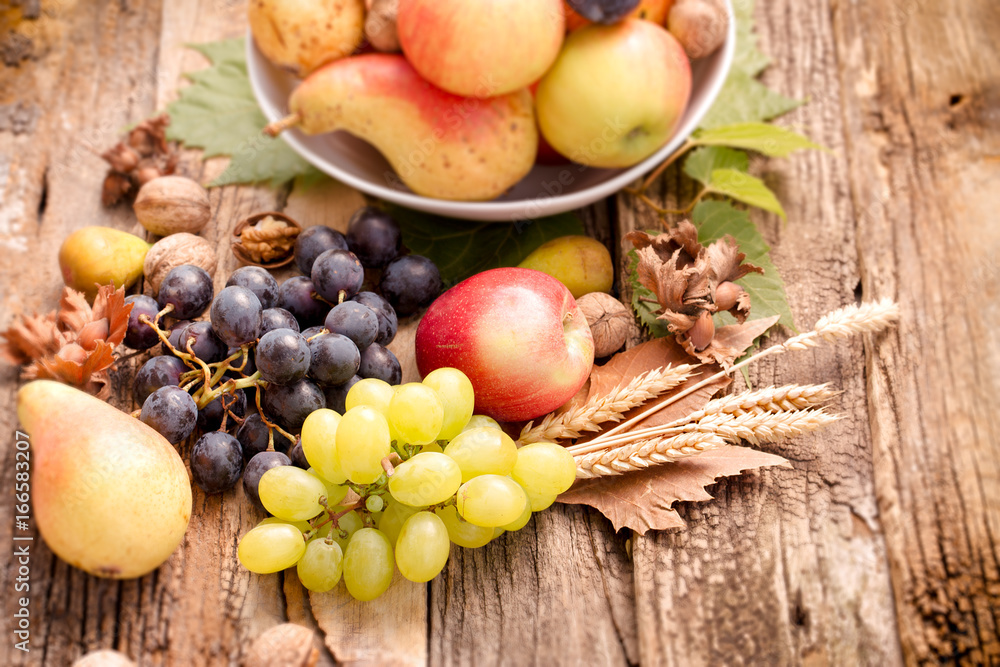 Healthy eating, healthy food - autumn organic fruit on rustic wooden table