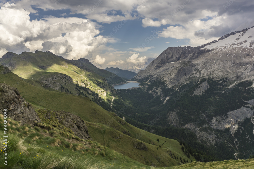 Lago di Fedaia and Marmolada massif in the beautiful landscape of the Dolomites. Italy.