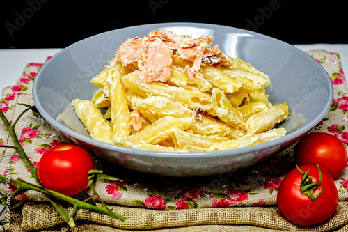 tasty pasta with salmon on a the table