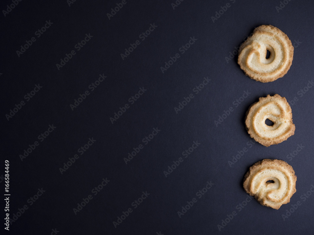 Danish vanilla wreaths cookies (vanillekranse) isolated on black background Danish vanilla wreaths cookies (vanillekranse) isolated on black background