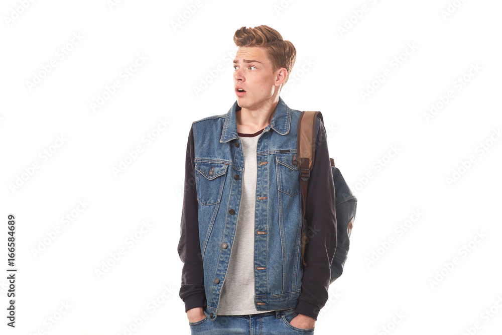 Portrait of schoolboy expressing emotions against white background Portrait of schoolboy expressing emotions against white background