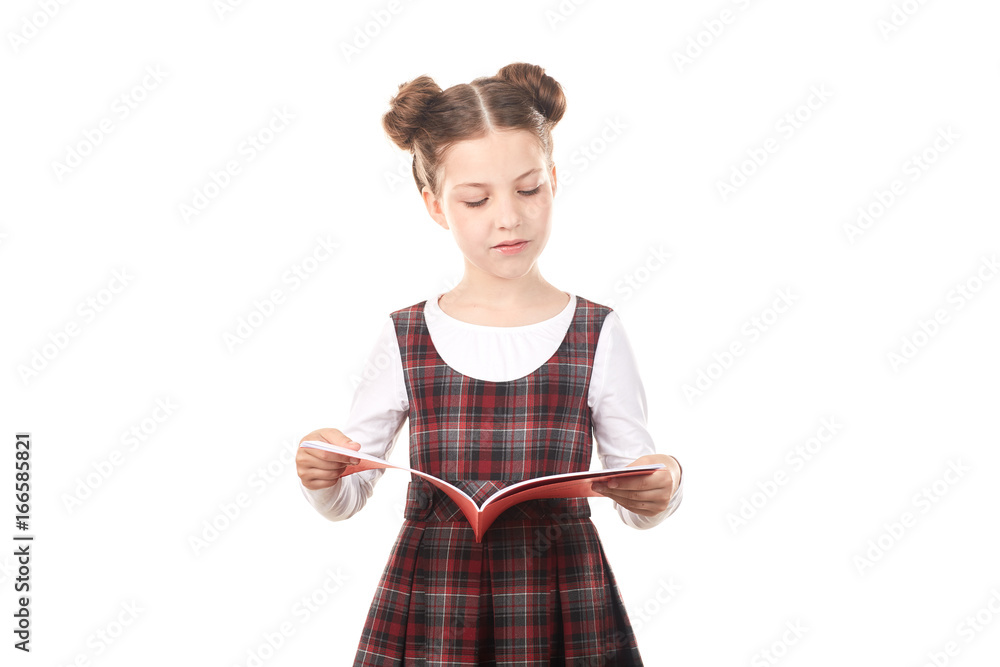 Elementary school girl reading book against white background Elementary school girl reading book against white background