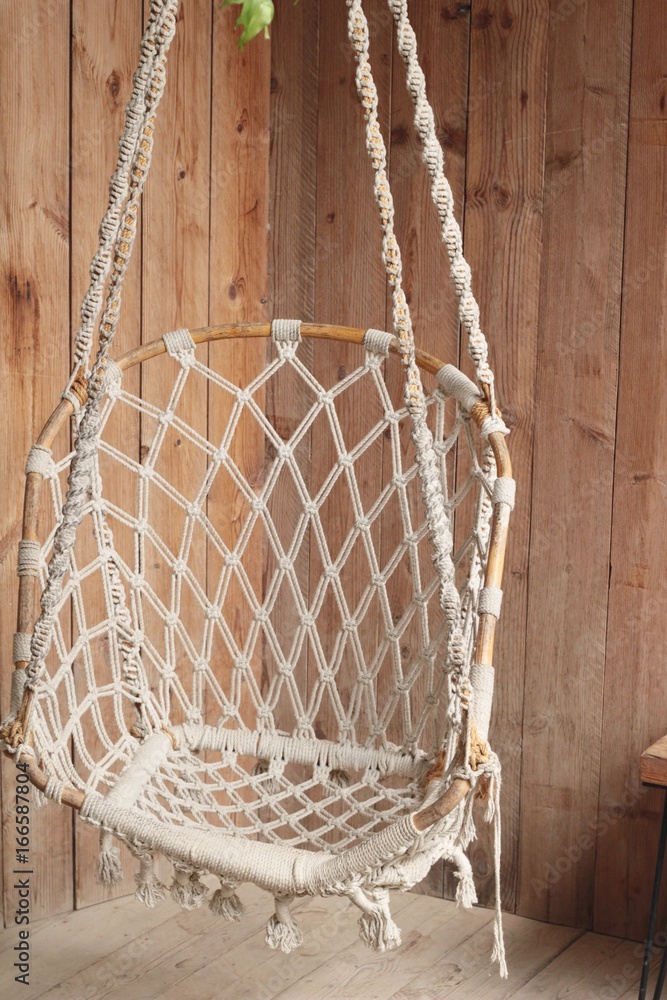 Obraz premium close up hanging chairs swing in a corner
