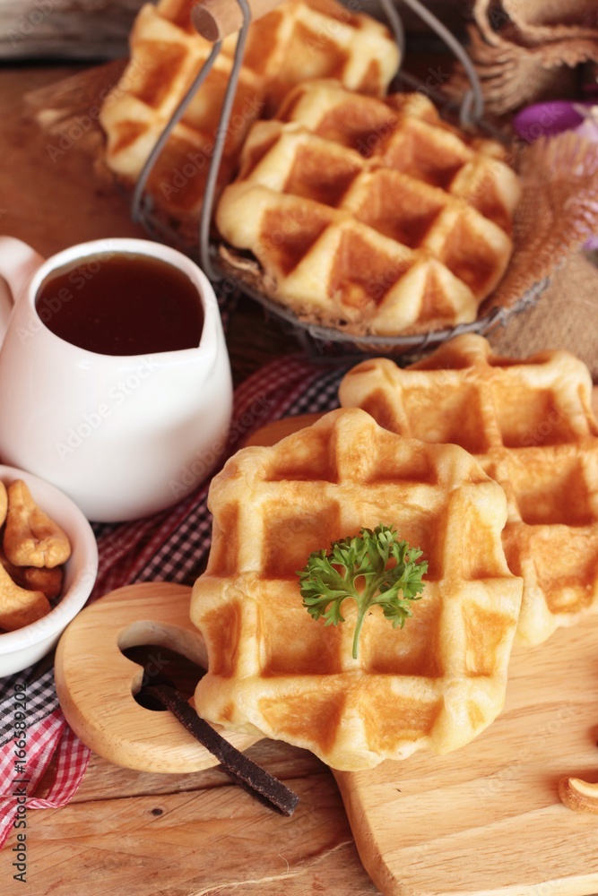 Waffles topped with honey, raisins and cashews. Waffles topped with honey, raisins and cashews.