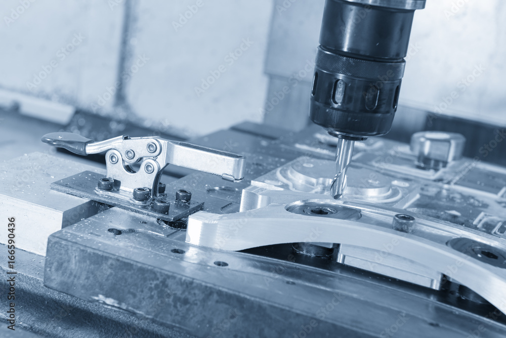 The CNC milling machine cutting the sample part with the ball endmill in light blue scene.The hi-precision mechanical part. The CNC milling machine cutting the sample part with the ball endmill in light blue scene.The hi-precision mechanical part.