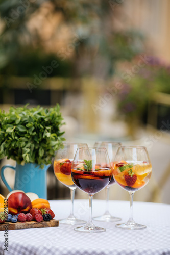 Delicious Red Sangria with fruits on table