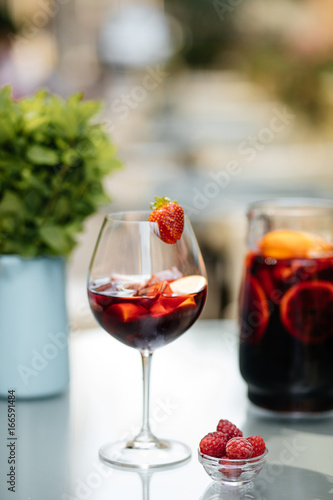 Delicious Red Sangria with fruits on table6555
