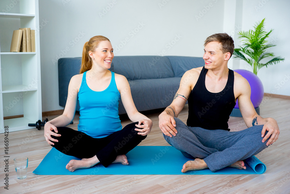 Pregnant woman doing exercises Pregnant woman doing exercises