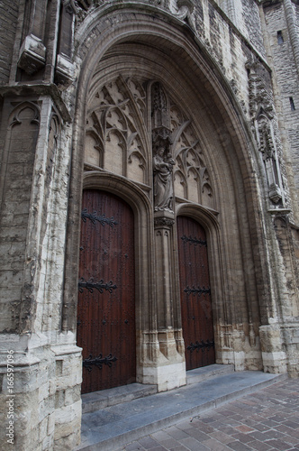 Medieval architecture style of door at St. Bavo s Cathedral in Ghent Belgium