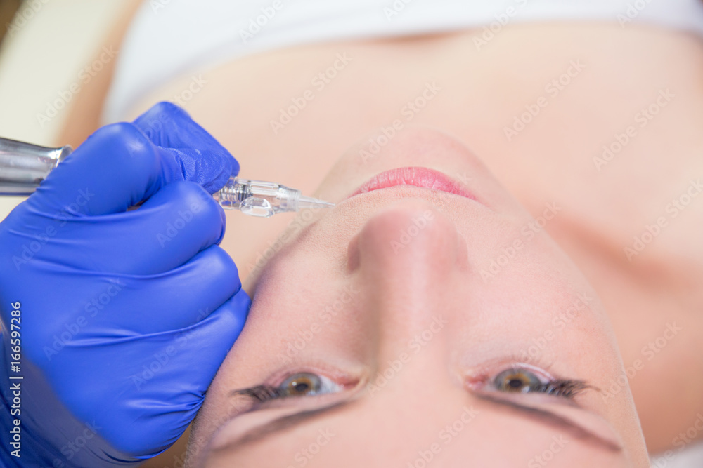 Closeup of beautiful woman face with botox and syringe Closeup of beautiful woman face with botox and syringe