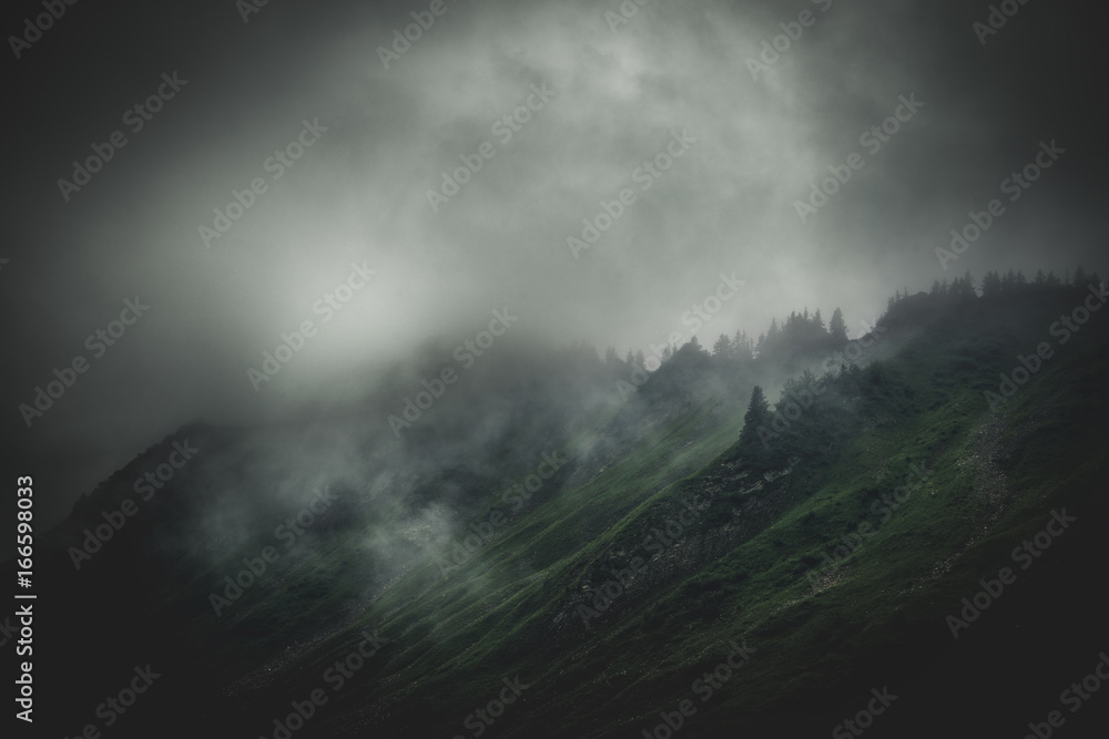 Stormy, cloud shrouded mountains and terrain