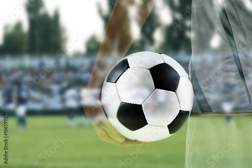 Professional football player holding ball on white background  closeup