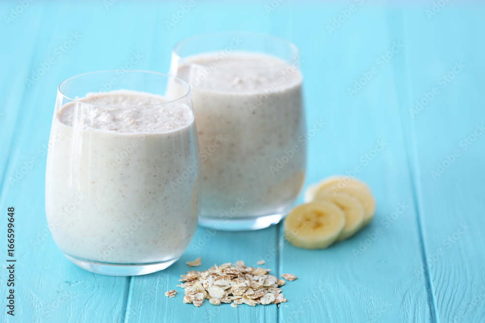 Fresh tasty smoothie with in glasses on table Fresh tasty smoothie with in glasses on table