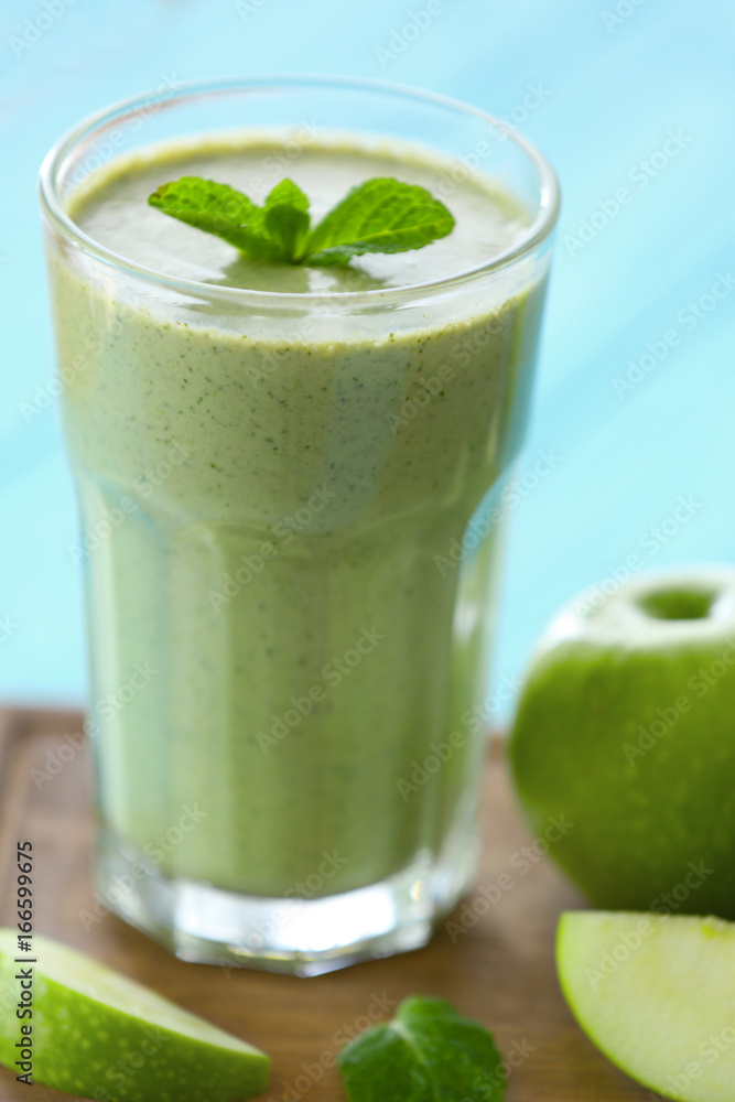Glass with fresh tasty fruit smoothie on table Glass with fresh tasty fruit smoothie on table