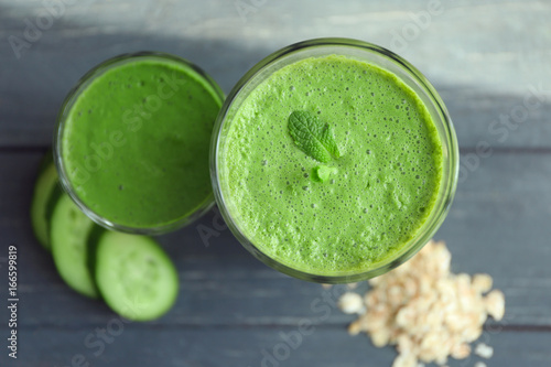 Fresh tasty smoothies in glasses on table