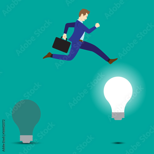 Businessman Jumping To Bright Light Bulb