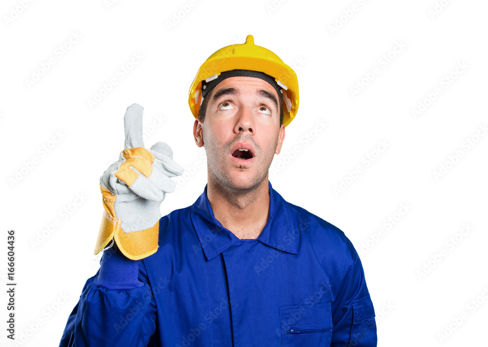 Surprised worker pointing up on white background Surprised worker pointing up on white background