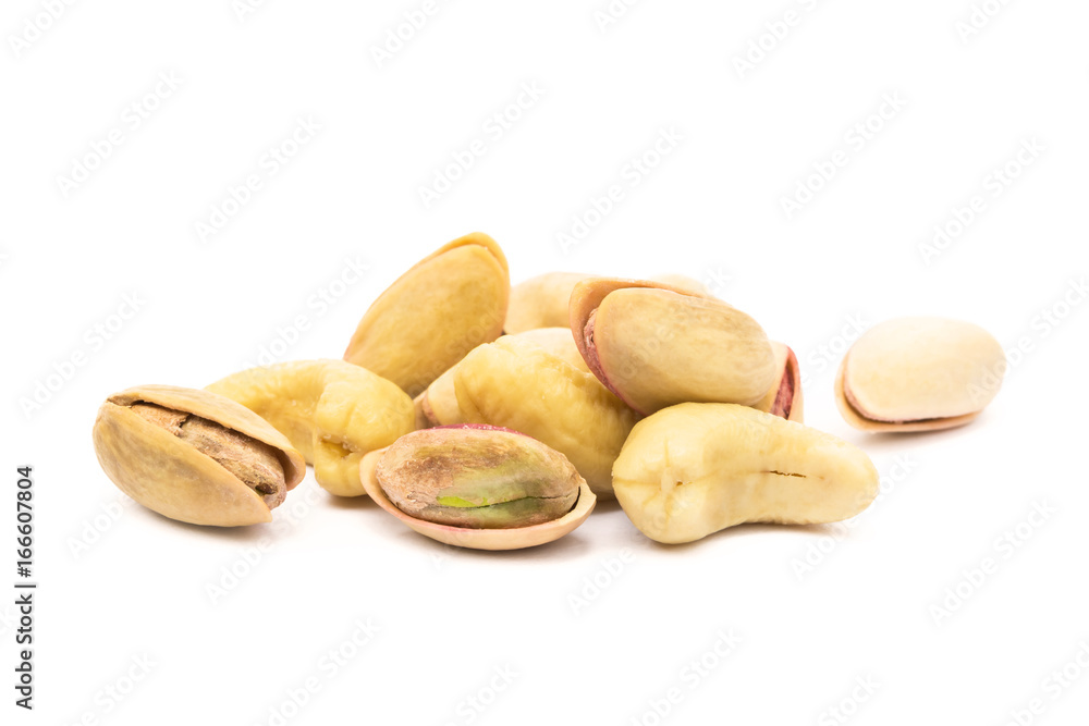 Fototapeta premium Pile of roasted pistachios and cashew isolated on white background