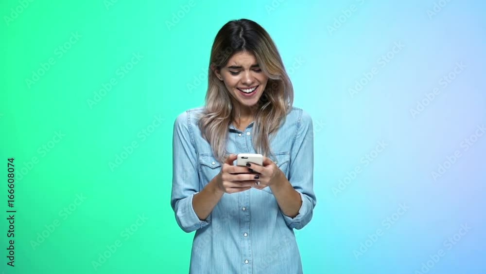 Young concentrated caucasian woman chatting by phone isolated Young concentrated caucasian woman chatting by phone isolated