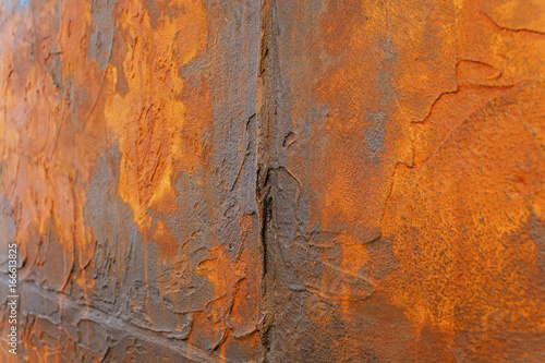 Wall with orange decorative plaster