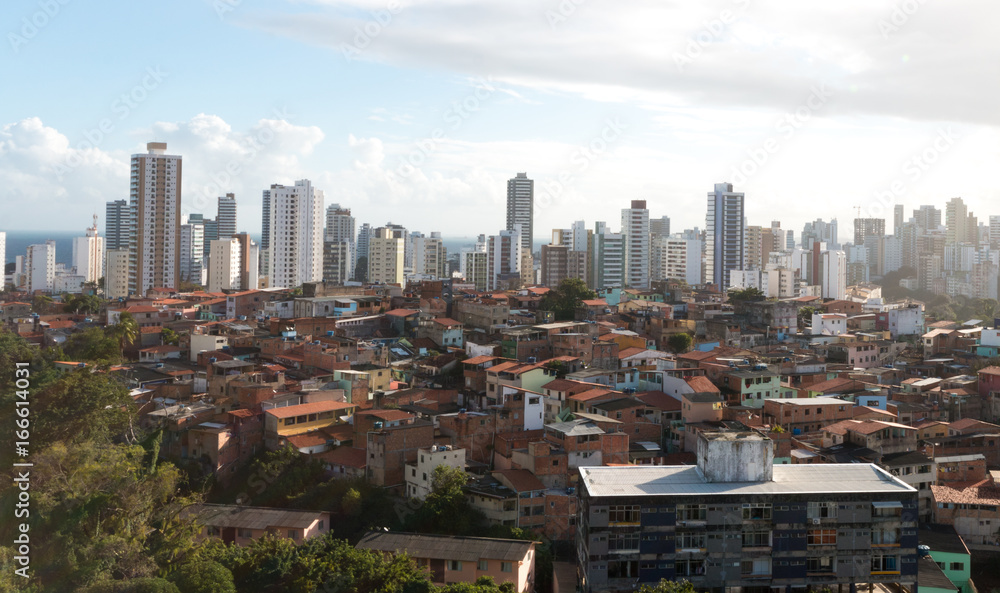Obraz premium Severe Urban Social Contrast with favela next to buildings